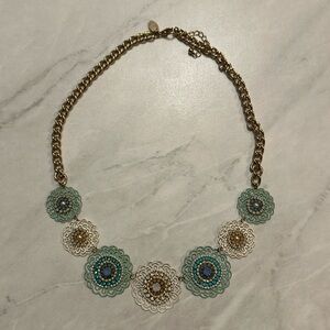 Charming Charlie’s Gold Statement Necklace with White and Blue Studded Flowers